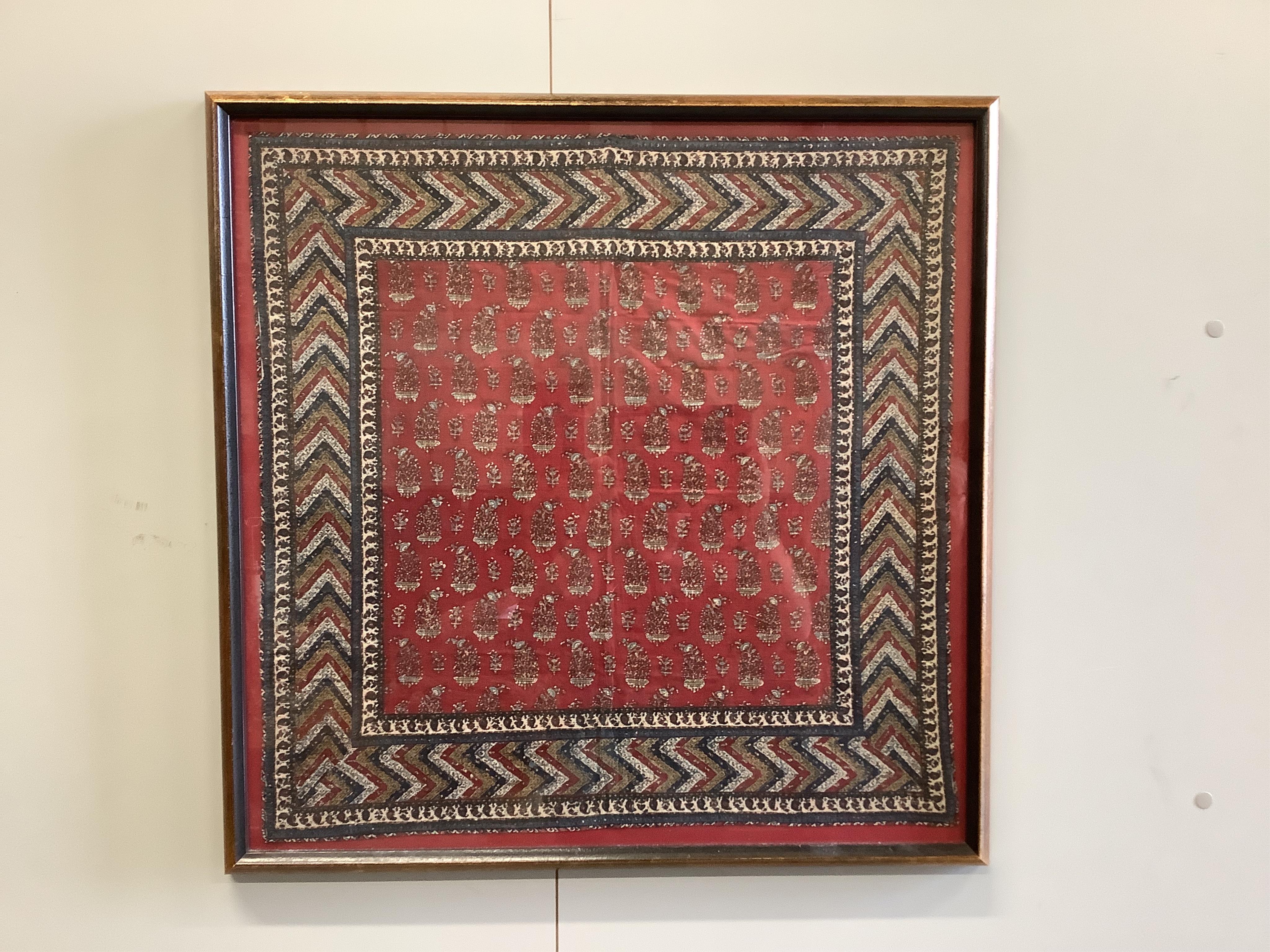 Two framed 19th century Indian Kalamkari boteh block printed prayer Niches, possibly from Machilitanam and a similar framed block printed square, possibly part of a table cover, largest 53cm wide x 67cm high (3). Conditi